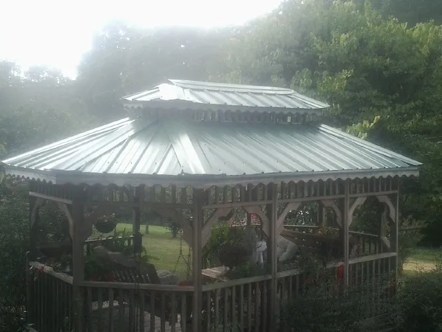 Two tier green metal roof on a garden gazebo in Hopewell Junction